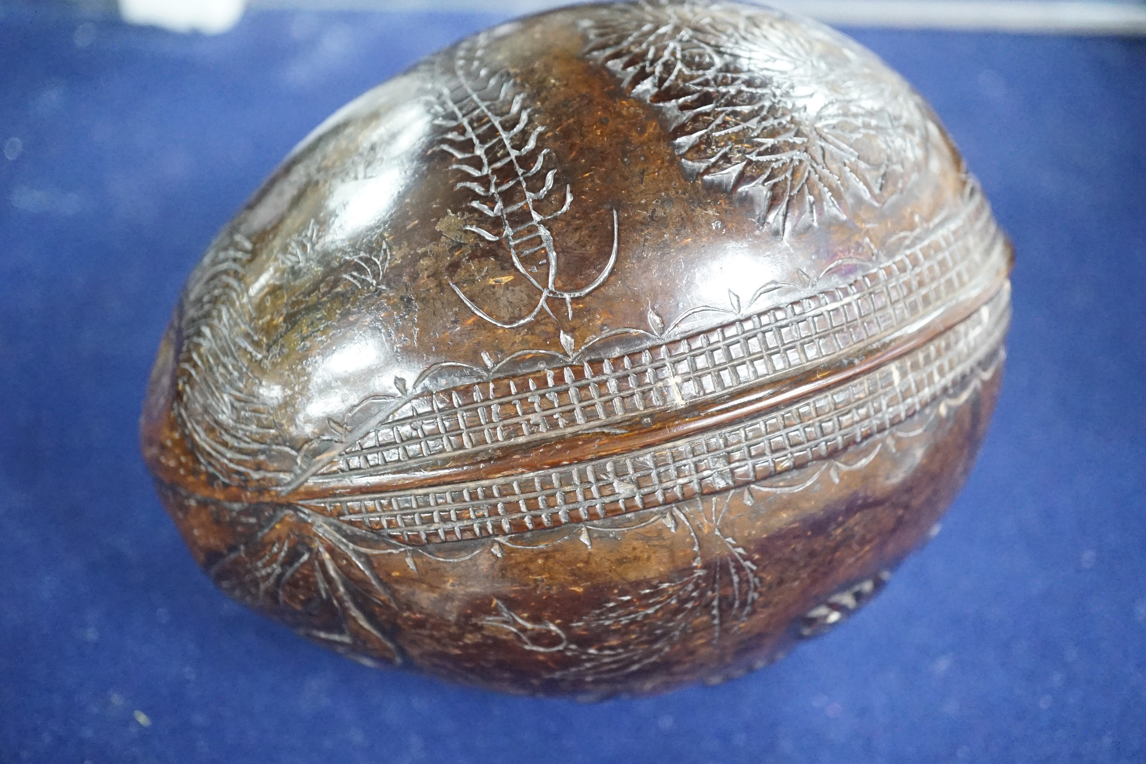 A 19th century carved coconut, 14 cm